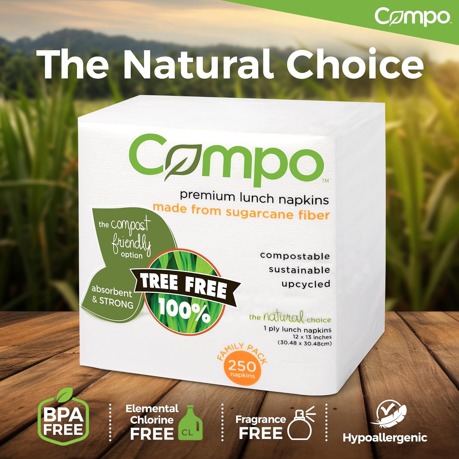 Package of Compo premium lunch napkins on wooden table with natural bamboo background. The natural choice: BPA Free, elemental chlorine free, fragrance free, hypoallergenic.